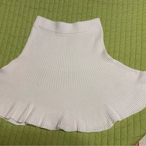 Free People white ribbed knit skirt. Sz M. 26”waist unstretched. 18” long.
